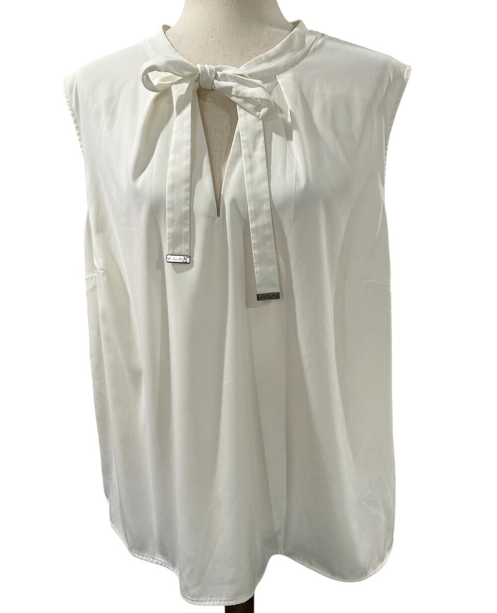 Calvin Klein Ivory Sleeveless Tie Neck Blouse Branded Metal Accents on Ties 2X